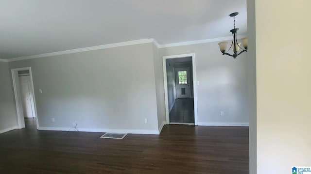 1525 Cresthill Rd, Birmingham, AL 35213 - empty room featuring dark wood-style flooring, crown molding, and a chandelier