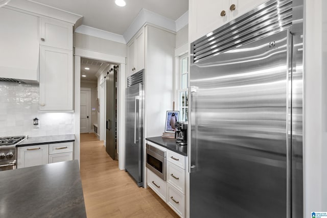 544 Preserve Way, Hoover, AL 35226 - kitchen featuring built in appliances, dark countertops, light wood-style floors, white cabinets, and recessed lighting