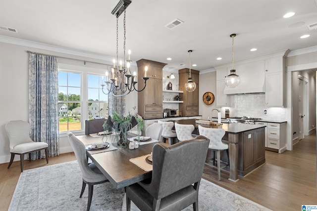 544 Preserve Way, Hoover, AL 35226 - dining space with crown molding, a chandelier, light wood finished floors, and recessed lighting