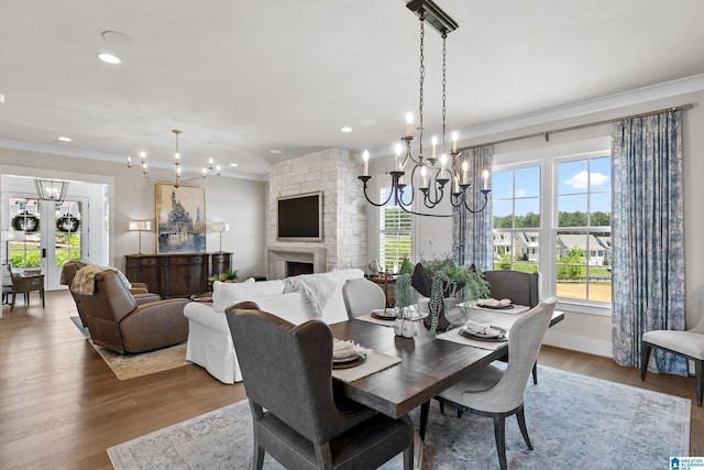544 Preserve Way, Hoover, AL 35226 - dining area featuring a chandelier, ornamental molding, wood finished floors, recessed lighting, and a fireplace