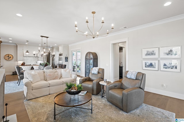 544 Preserve Way, Hoover, AL 35226 - living area with a chandelier, crown molding, light wood finished floors, and recessed lighting