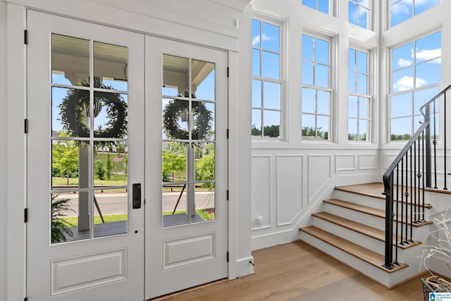 544 Preserve Way, Hoover, AL 35226 - doorway to outside with stairway, light wood-style floors, and a decorative wall