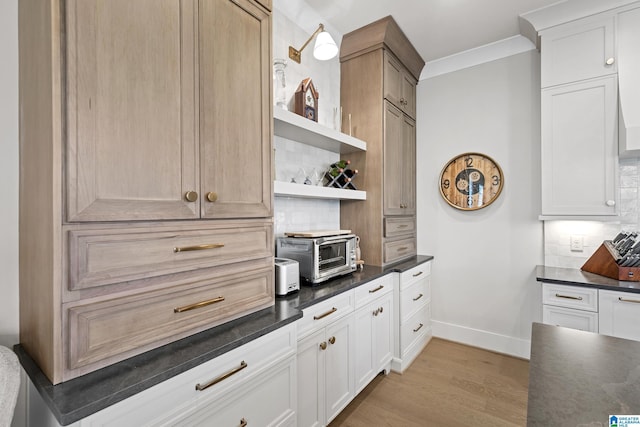 544 Preserve Way, Hoover, AL 35226 - kitchen with dark countertops, open shelves, tasteful backsplash, light wood-style floors, and white cabinets