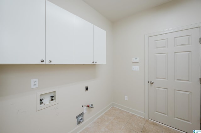 932 Cove Cir, Hoover, AL 35244 - laundry room featuring cabinet space, hookup for a washing machine, electric dryer hookup, hookup for a gas dryer, and light tile patterned floors