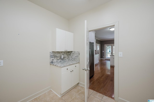 932 Cove Cir, Hoover, AL 35244 - laundry area featuring light tile patterned flooring and ornamental molding
