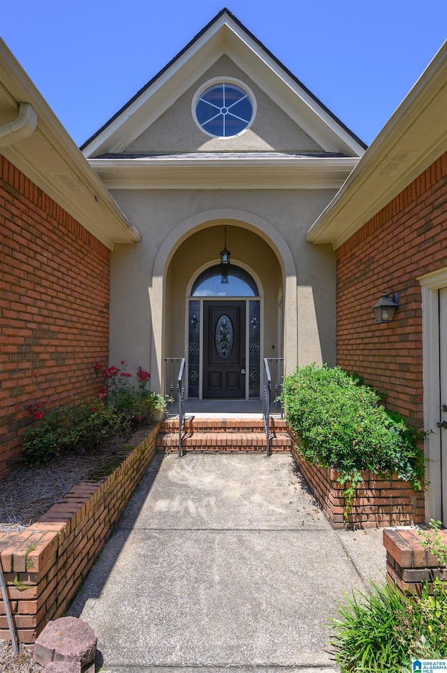 932 Cove Cir, Hoover, AL 35244 - doorway to property with stucco siding and brick siding