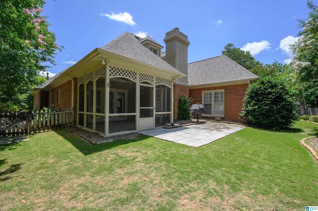 932 Cove Cir, Hoover, AL 35244 - rear view of property featuring a sunroom, a patio area, brick siding, and a shingled roof
