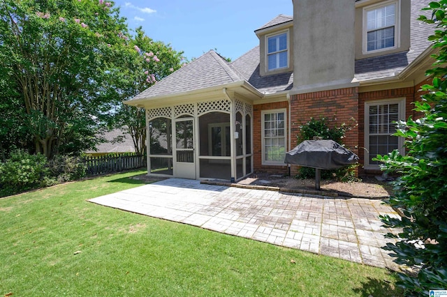 932 Cove Cir, Hoover, AL 35244 - rear view of house with a sunroom, a patio area, a shingled roof, and stucco siding