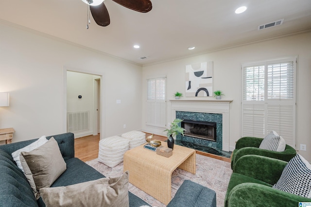 932 Cove Cir, Hoover, AL 35244 - living room with ornamental molding, ceiling fan, healthy amount of natural light, wood finished floors, and a fireplace