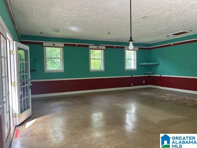 327 Canyon Ridge Rd, Sylacauga, AL 35151 - garage featuring baseboards
