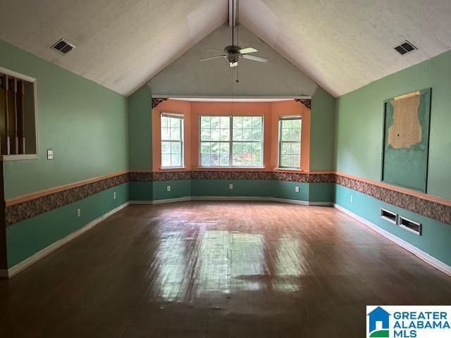 327 Canyon Ridge Rd, Sylacauga, AL 35151 - empty room with ceiling fan, wood finished floors, and lofted ceiling