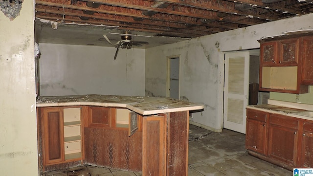 1146 Oakridge Dr, Leeds, AL 35094 - kitchen with a ceiling fan, a peninsula, and light countertops