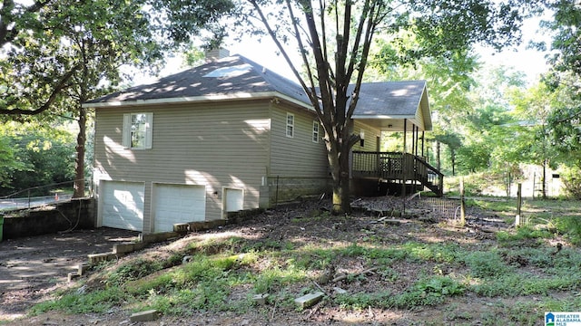 1146 Oakridge Dr, Leeds, AL 35094 - view of side of home with a garage, a chimney, and a wooden deck