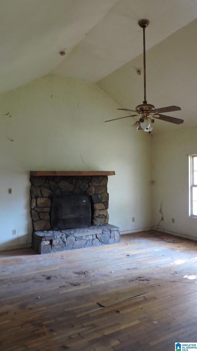 1146 Oakridge Dr, Leeds, AL 35094 - unfurnished living room featuring a fireplace, wood finished floors, high vaulted ceiling, and a ceiling fan