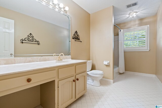 4737 Cloud Ln, Birmingham, AL 35243 - full bath featuring vanity, shower / bath combination with curtain, tile patterned floors, and a textured ceiling