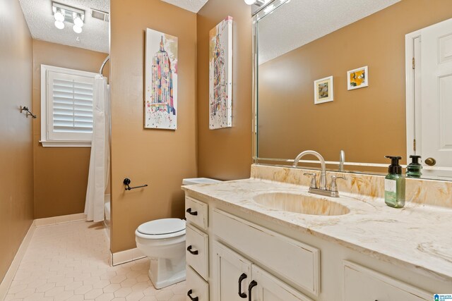 4737 Cloud Ln, Birmingham, AL 35243 - full bath featuring vanity, a textured ceiling, tile patterned floors, and shower / bath combo