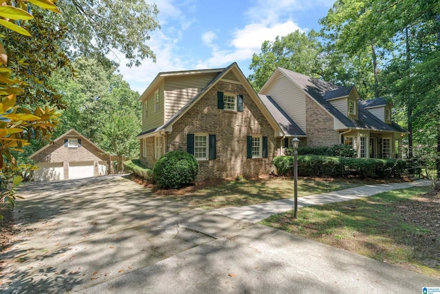 4737 Cloud Ln, Birmingham, AL 35243 - traditional home with an outbuilding, brick siding, and a detached garage