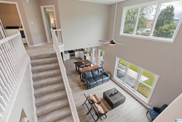 483 Old Cahaba Way, Helena, AL 35080 - living room featuring wood finished floors, ceiling fan, stairway, and a towering ceiling