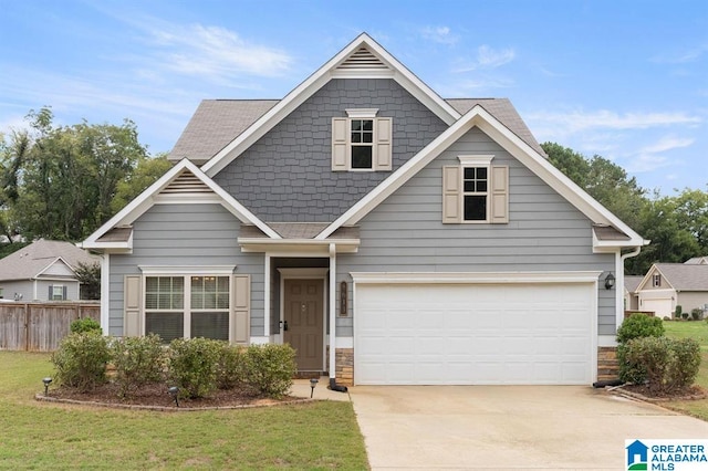 8613 Clarke Ln, Leeds, AL 35094 - view of front facade featuring concrete driveway, stone siding, an attached garage, and a shingled roof