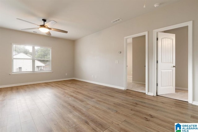 8613 Clarke Ln, Leeds, AL 35094 - empty room featuring a ceiling fan, wood finished floors, and a smoke detector