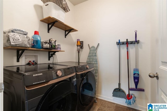 8613 Clarke Ln, Leeds, AL 35094 - laundry area with washing machine and clothes dryer and tile patterned floors