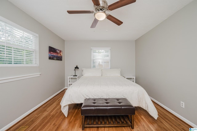 3350 Rosemary Ln, Vestavia Hills, AL 35216 - bedroom with multiple windows, wood finished floors, and a ceiling fan