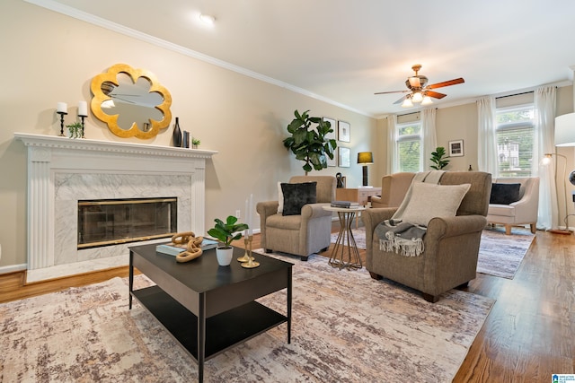 1812 Cross Cir, Hoover, AL 35244 - living room featuring wood finished floors, a ceiling fan, a high end fireplace, and ornamental molding