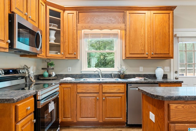 1812 Cross Cir, Hoover, AL 35244 - kitchen featuring stainless steel appliances, dark countertops, glass insert cabinets, and brown cabinets