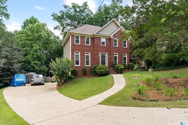 1812 Cross Cir, Hoover, AL 35244 - colonial-style house featuring concrete driveway, a front lawn, and brick siding