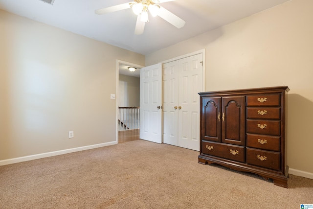 1812 Cross Cir, Hoover, AL 35244 - unfurnished bedroom featuring light carpet, a closet, and a ceiling fan