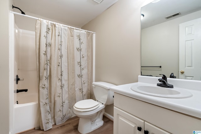 1812 Cross Cir, Hoover, AL 35244 - bathroom featuring wood finished floors, vanity, and shower / tub combo