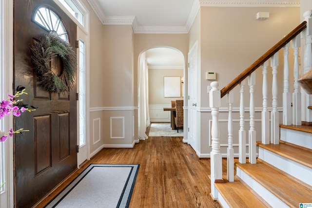 1812 Cross Cir, Hoover, AL 35244 - foyer entrance with arched walkways, wood finished floors, ornamental molding, wainscoting, and stairs