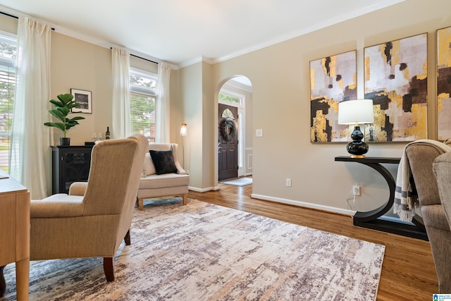 1812 Cross Cir, Hoover, AL 35244 - sitting room with arched walkways, wood finished floors, and ornamental molding