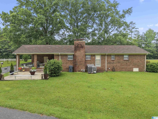 8892 Moody Pkwy, Odenville, AL 35120 - back of house featuring entry steps, a patio area, a chimney, and brick siding