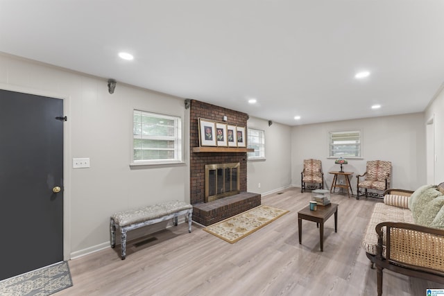 8892 Moody Pkwy, Odenville, AL 35120 - living area with a brick fireplace, light wood-style flooring, and recessed lighting