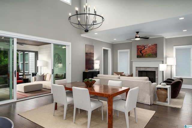 3041 Adley Cir, Hoover, AL 35244 - dining space featuring a ceiling fan, ornamental molding, a fireplace, recessed lighting, and dark wood-style floors