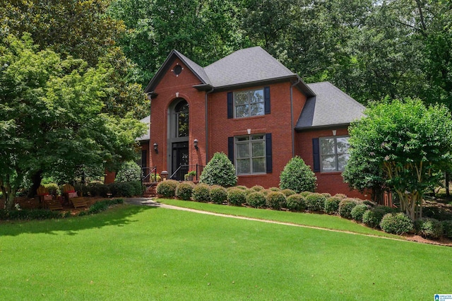 4208 Waterford Ln, Trussville, AL 35173 - view of front of home with a front lawn, brick siding, and roof with shingles
