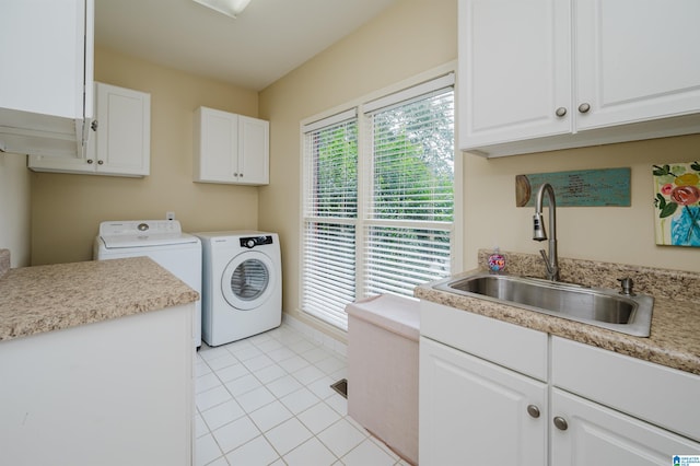 4208 Waterford Ln, Trussville, AL 35173 - washroom featuring washing machine and clothes dryer, cabinet space, and light tile patterned floors