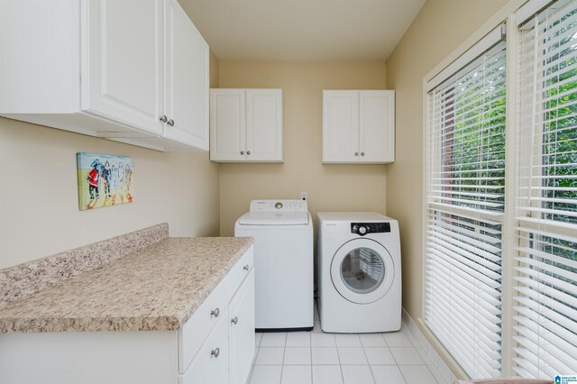4208 Waterford Ln, Trussville, AL 35173 - washroom with washer and clothes dryer, cabinet space, and light tile patterned floors