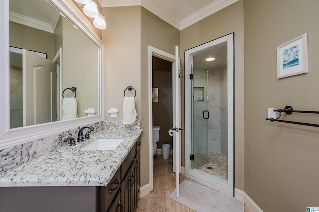 4208 Waterford Ln, Trussville, AL 35173 - full bathroom with ornamental molding, vanity, wood finished floors, and a stall shower