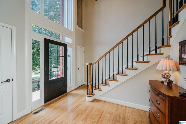 4208 Waterford Ln, Trussville, AL 35173 - foyer entrance with a towering ceiling, wood finished floors, and stairs