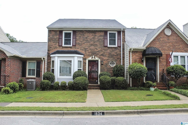 1534 Cambridge Pl, Anniston, AL 36207 - traditional-style house with a front lawn and brick siding