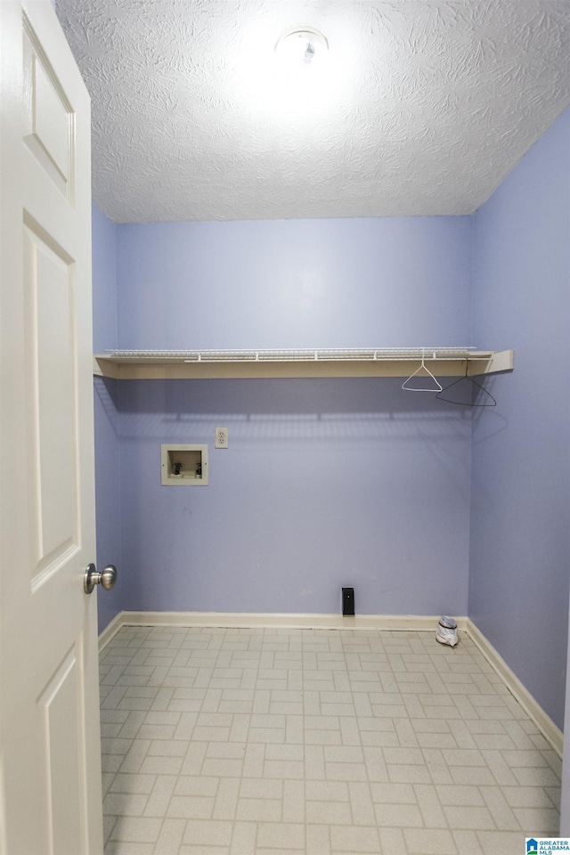 1534 Cambridge Pl, Anniston, AL 36207 - laundry area featuring hookup for a washing machine and a textured ceiling
