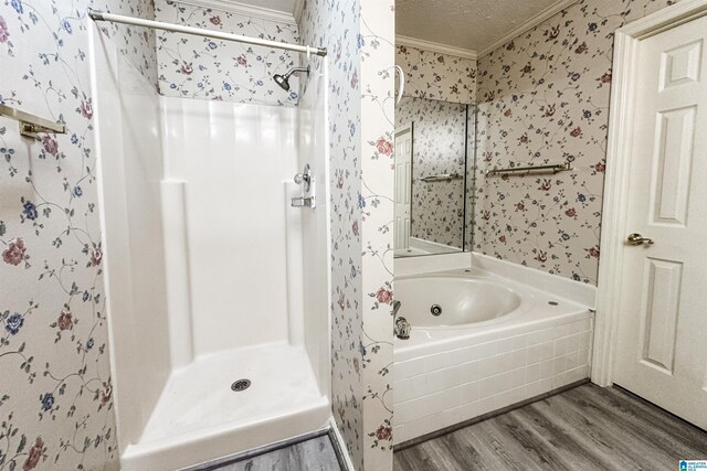 1534 Cambridge Pl, Anniston, AL 36207 - full bath with crown molding, wood finished floors, wallpapered walls, a stall shower, and a bath