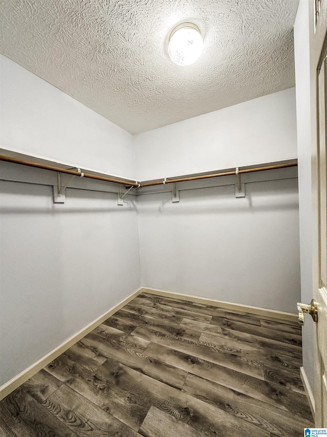 1534 Cambridge Pl, Anniston, AL 36207 - walk in closet featuring dark wood finished floors