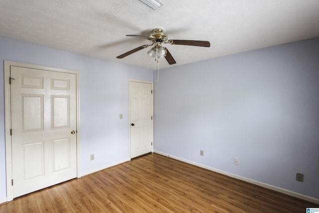 1534 Cambridge Pl, Anniston, AL 36207 - unfurnished bedroom with wood finished floors and a ceiling fan