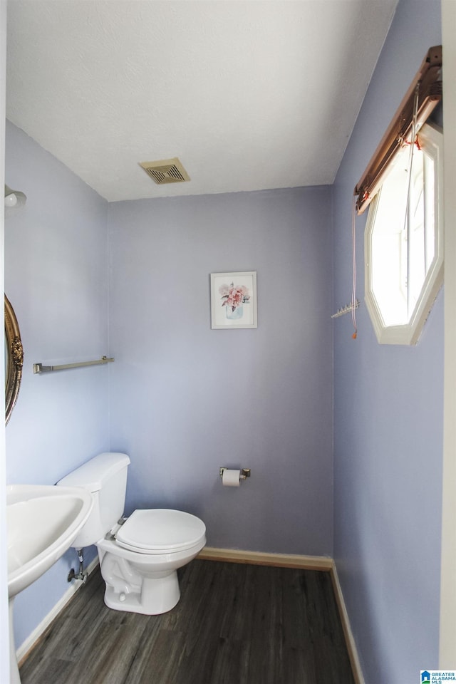 1534 Cambridge Pl, Anniston, AL 36207 - bathroom featuring wood finished floors and toilet