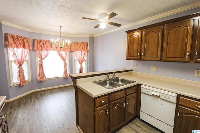 1534 Cambridge Pl, Anniston, AL 36207 - kitchen featuring dishwasher, a peninsula, a chandelier, a ceiling fan, and light countertops