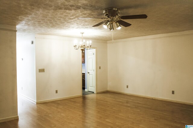 1534 Cambridge Pl, Anniston, AL 36207 - empty room with ceiling fan, wood finished floors, a chandelier, and a textured ceiling