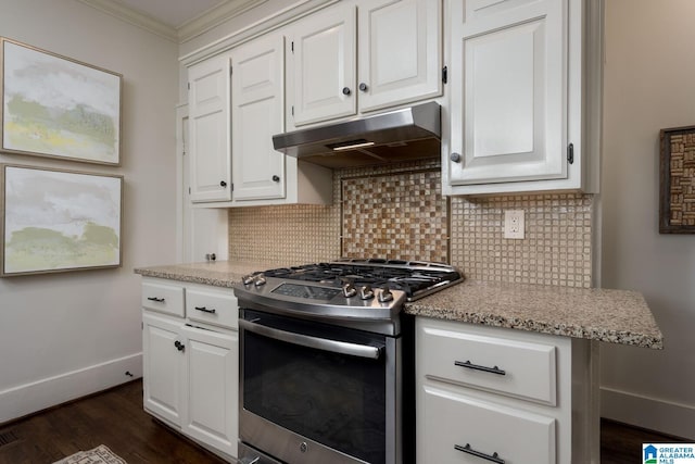 117 Elm St, Mountain Brook, AL 35213 - kitchen with gas range, under cabinet range hood, crown molding, white cabinetry, and tasteful backsplash